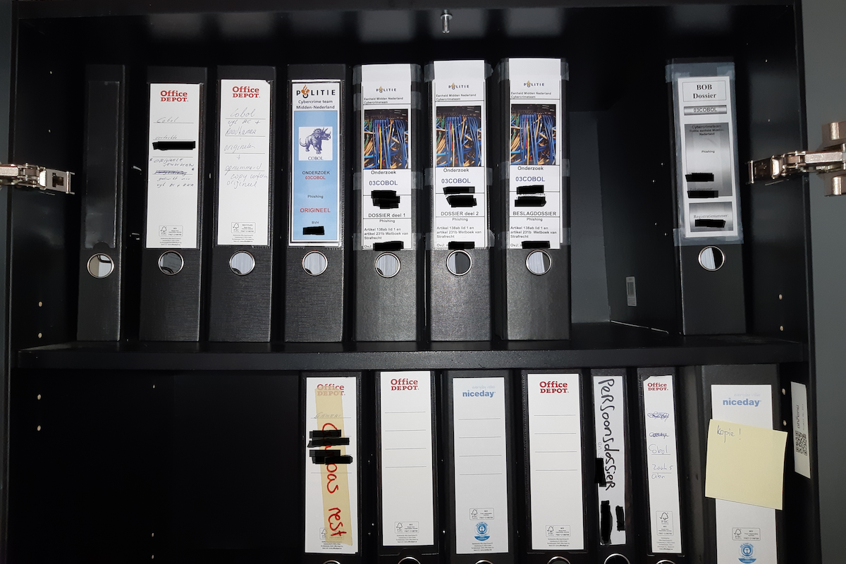 Police case file binders (redacted)